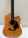 Brown acoustic guitar