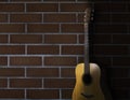 brown acoustic guitar stand in front of brick wall background. Guitar body part front made with top solid. Royalty Free Stock Photo