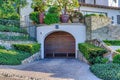 Brown arched wood door of garage under luxurious house in San Diego California Royalty Free Stock Photo