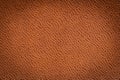 Brown artificial or synthetic leather background with neat texture and copy space Royalty Free Stock Photo