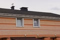 Brown attic of a private house with two small white windows Royalty Free Stock Photo