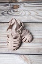 Rubber Brown baby girl sandals shoes on a wooden floor Royalty Free Stock Photo