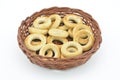Brown basket and fine bagels on white background