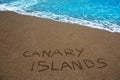 Brown beach sand written word Canary islands
