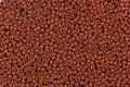 Brown beads texture on macro. Royalty Free Stock Photo