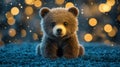 Cute brown bear cub resting on soft surface with glowing bokeh background in a cozy setting Royalty Free Stock Photo