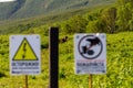 Brown bears near the Kuril lake. Warning signs on the fence in the Kronotsky Reserve, Russia, Kamchatka Royalty Free Stock Photo