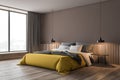 Brown bedroom corner with yellow bed Royalty Free Stock Photo