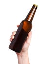 Brown beer bottle in hand isolated on white background Royalty Free Stock Photo