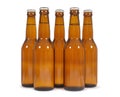 Row of brown beer bottles isolated on white background Royalty Free Stock Photo