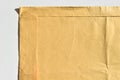 Brown and beige cardboard paper mail envelope on a white background Royalty Free Stock Photo