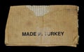 Brown and beige corrugated cardboard detail, made in Turkey, isolated on black background Royalty Free Stock Photo