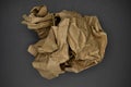 Brown and beige crumpled paper ball.