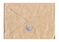 Brown and beige paper mail stamped envelope on a white background