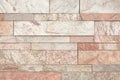 Brown or beige stone wall tiles texture.