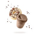 Brown beige to go cup hot coffee with chocolate donut with sprinkles flying isolated on white background Royalty Free Stock Photo