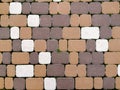 Brown beige walkway near the house, paved with square bricks. Royalty Free Stock Photo