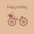 Brown bike with flowers in a basket on a beige background. Happy birthday text