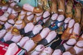 Brown, black, blue and red sandals with colorful flowers in mannequin feet at Olvera Street in Los Angeles California Royalty Free Stock Photo