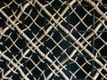 Brown and black nylon ropes weaven with black steel bars as a wall Royalty Free Stock Photo