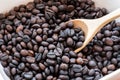 Brown and black roasted arabica coffee beans. mashed roasted coffee beans is ingredients of espresso, cappuccino, latte, mocha, Royalty Free Stock Photo