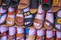 Brown and black sandals with colorful flowers in mannequin feet at Olvera Street in Los Angeles California Royalty Free Stock Photo