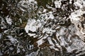 Brown, Black and White Ripples on a River Detail