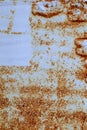 Brown, black and yellow rust and dirt on white enamel. Rusted brown and white abstract texture. Corroded white metal background. Royalty Free Stock Photo