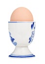 brown boiled egg in cup with a blunt end up Royalty Free Stock Photo