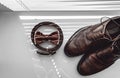 Brown bow tie, leather shoes and belt. Grooms wedding morning. Close up of modern man accessories