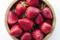 Brown bowl filled with strawberries