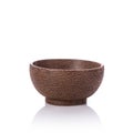 Brown bowl made from palm wood. Studio shot isolated on white Royalty Free Stock Photo