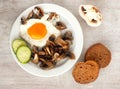 Brown bread, cucumbe, fried eggs and champignons