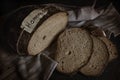 Sliced homemade rye bread. Kitchen table flat lay image