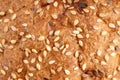 a brown bread with seeds close up macro. background texture Royalty Free Stock Photo