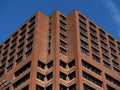 Brown Brick Building Against A Blue Sky