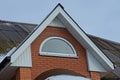 Brown brick loft of a private house with one white window Royalty Free Stock Photo