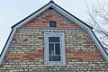 Brown brick loft of a private house with one white window Royalty Free Stock Photo