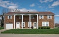 Brown Brick Lower Income Housing with White Pillars