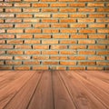 Brown brick wall and grunge wood floor background Royalty Free Stock Photo