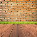 Brown brick wall and grunge wood floor background Royalty Free Stock Photo