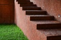 brown brick wall and staircase on green grass Royalty Free Stock Photo
