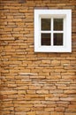 Brown brick wall and white window background Royalty Free Stock Photo