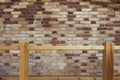 Brown brick wall with wooden handrails, indoor