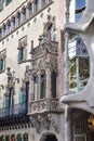 a brown building with bas-reliefs and balconies. Barcelona