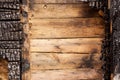 Brown burnt wall of house of wooden planks with embossed texture. background for copy space. concept of loss of real estate or Royalty Free Stock Photo