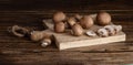 Brown button mushroom Agaricus brunnescens on a cutting board Royalty Free Stock Photo