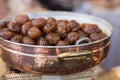 Brown Candied Chestnuts inside Copper Bowl: Food Theme Royalty Free Stock Photo