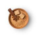Brown cane granulated and cubes sugar in wooden bowl with spices Royalty Free Stock Photo