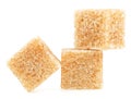 Brown cane sugar cubes isolated on white background Royalty Free Stock Photo